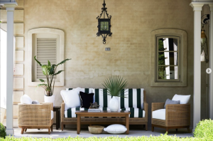 outdoor furniture, an outside sofa withcolor black and white stripes, along with wooden furniture