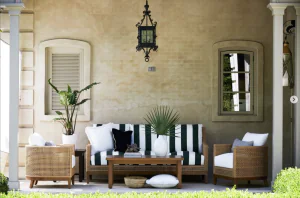 outdoor furniture, an outside sofa withcolor black and white stripes, along with wooden furniture